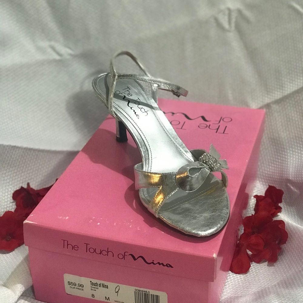 Women’s size 9 silver open toed heels.